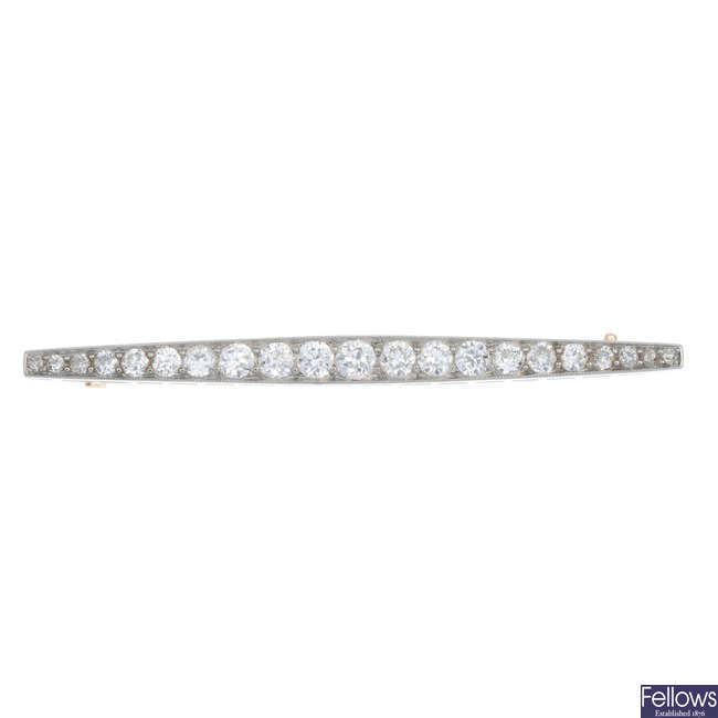 An early 20th century gold and platinum diamond bar brooch. 