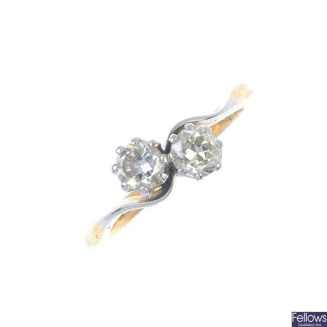A mid 20th century 18ct gold diamond two-stone crossover ring.