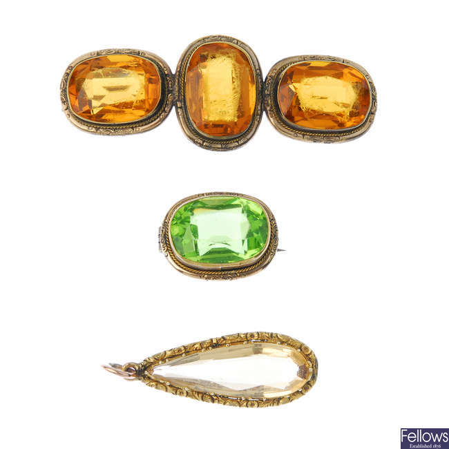 Two late 19th century paste brooches and a citrine pendant.