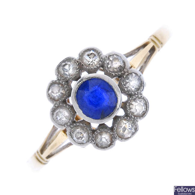 An early 20th century 18ct gold sapphire and diamond cluster ring.