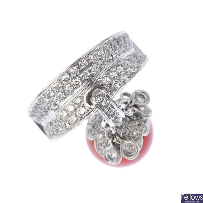 A diamond and coral dress ring.