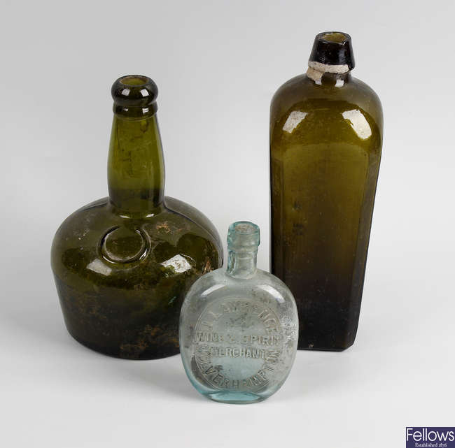 Two boxes containing a large collection of assorted glass bottles