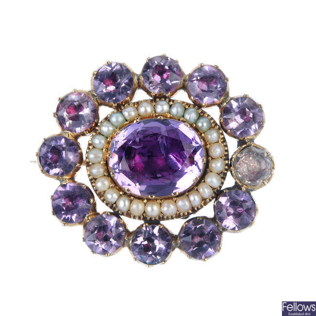 A late 19th century amethyst and split pearl mourning brooch.