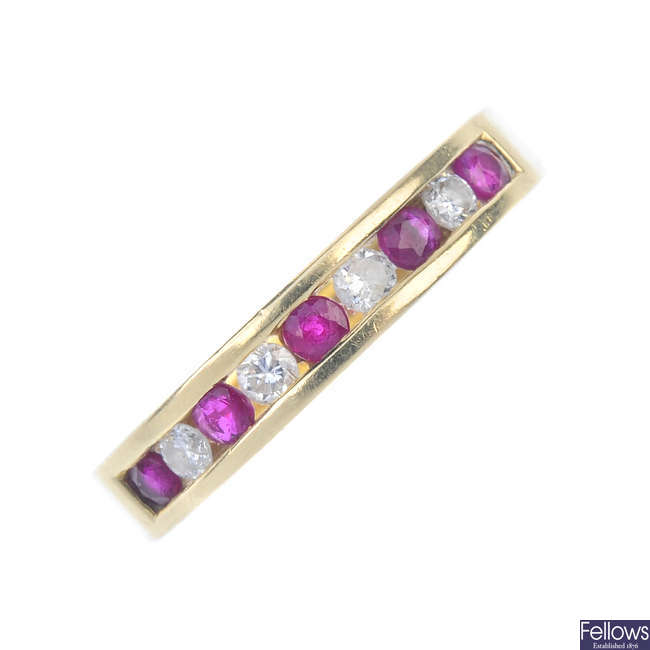 An 18ct gold ruby and diamond half-circle eternity ring.