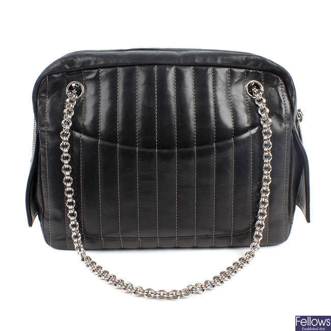 CHANEL - a pinstripe leather bag.