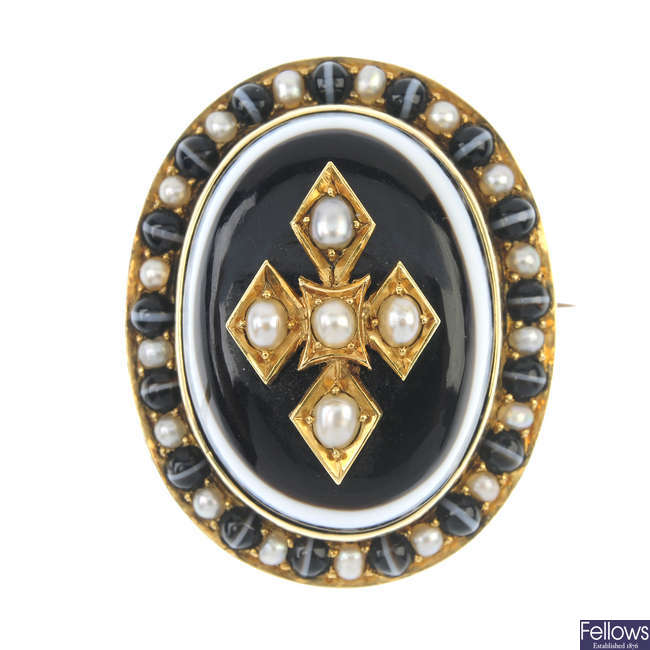 A mid Victorian gold banded agate and split pearl memorial brooch.