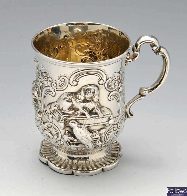 A mid-Victorian silver chased & embossed mug with dog.