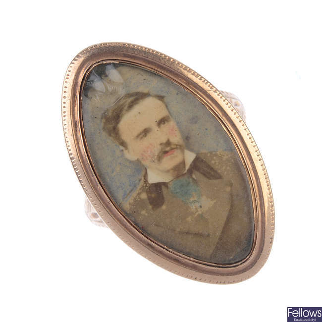 A late Georgian gold memorial ring with later added miniature portrait. 