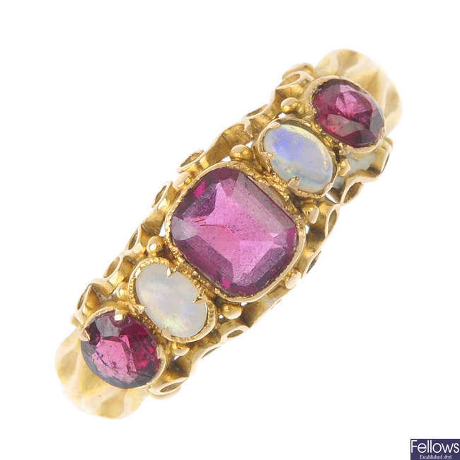 A mid Victorian 15ct gold garnet and opal ring.