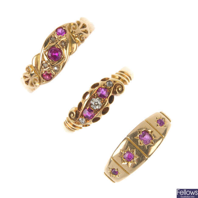 A selection of three late 19th century and early 20th century gold ruby and diamond rings.