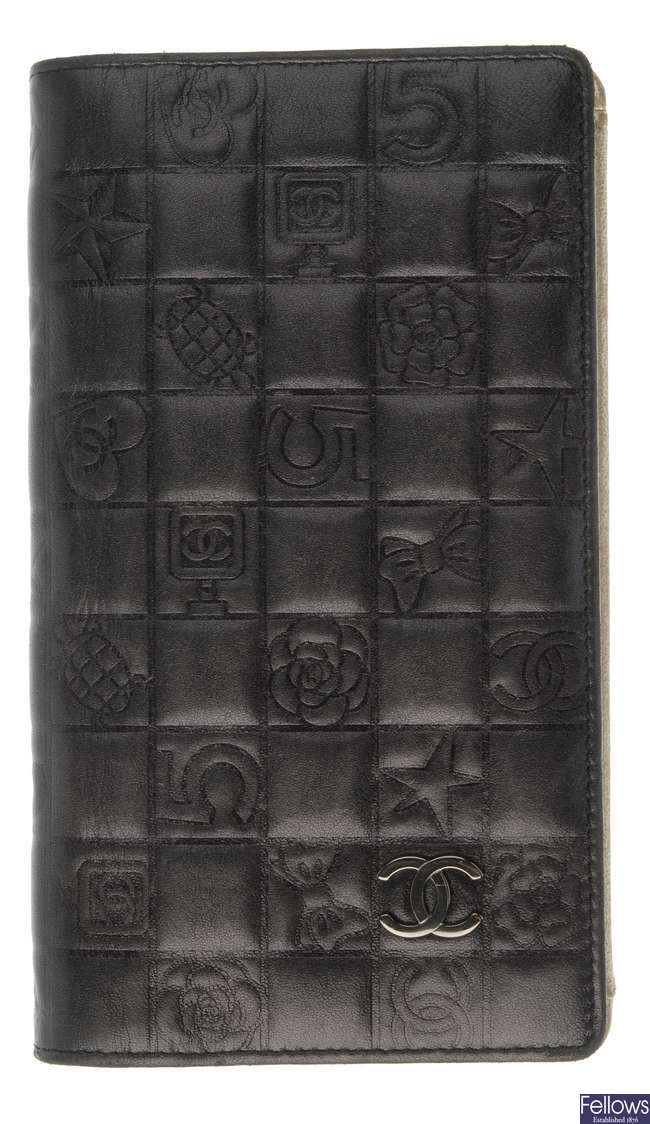 CHANEL - an embossed logo wallet.