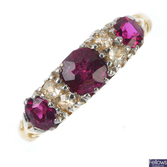 An Edwardian 18ct gold ruby three-stone and diamond ring.