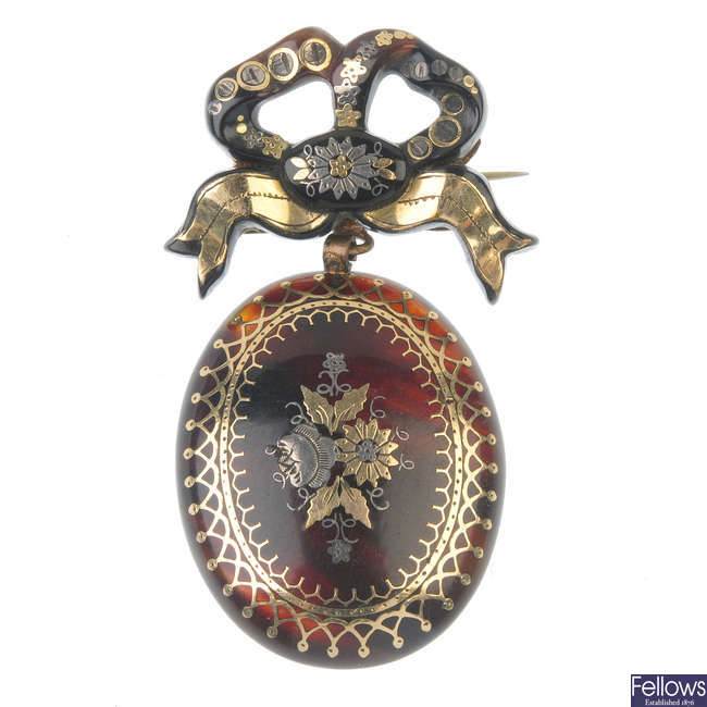 A late 19th century pique tortoiseshell brooch.