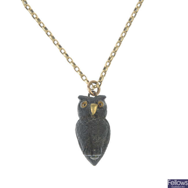 An early 20th century bog oak owl pendant.