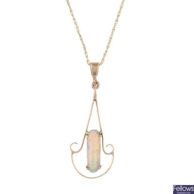 An early 20th century gold opal pendant, with chain.