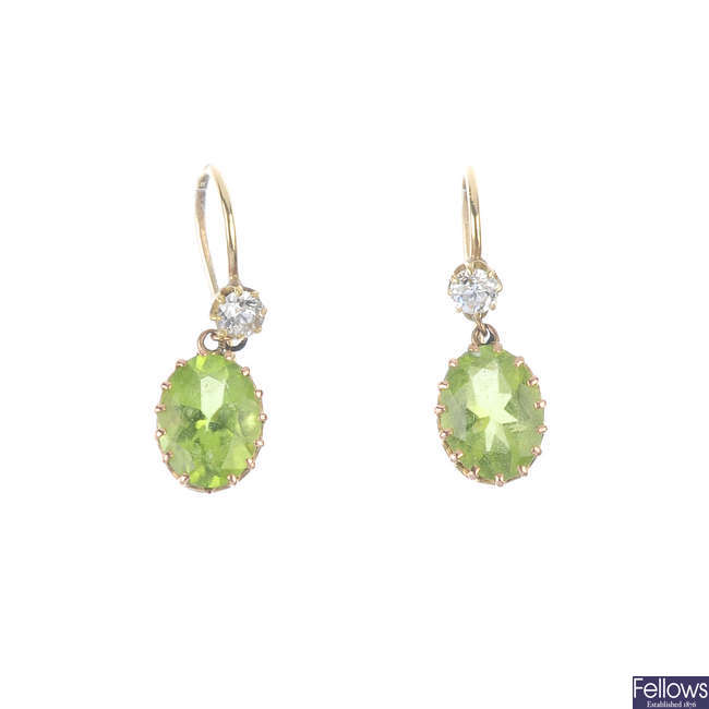 A pair of early 20th century gold, peridot and diamond ear pendants.
