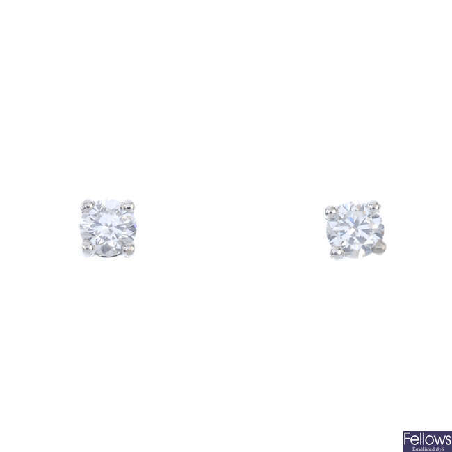A pair of brilliant-cut diamond single-stone ear studs.