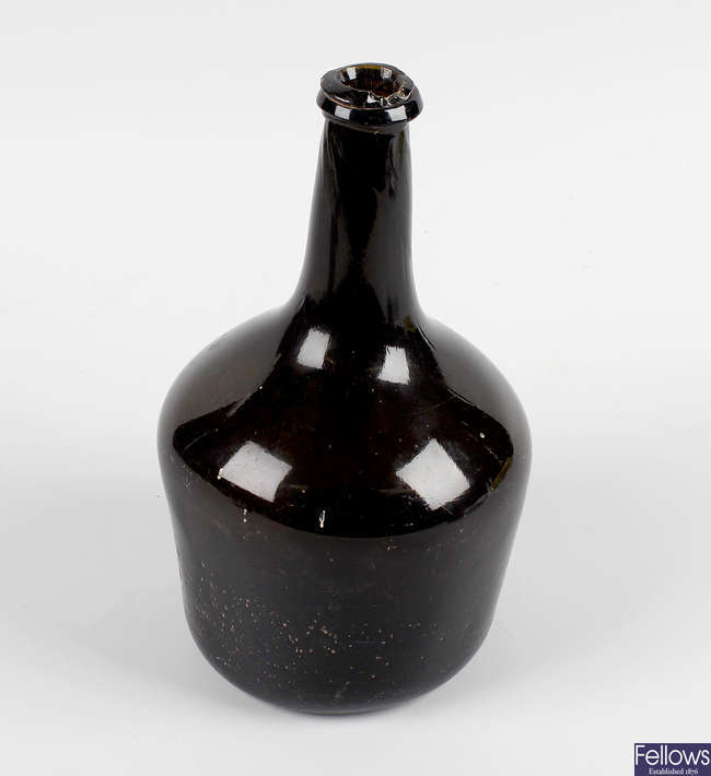 An 18th century green-brown glass utility bottle.