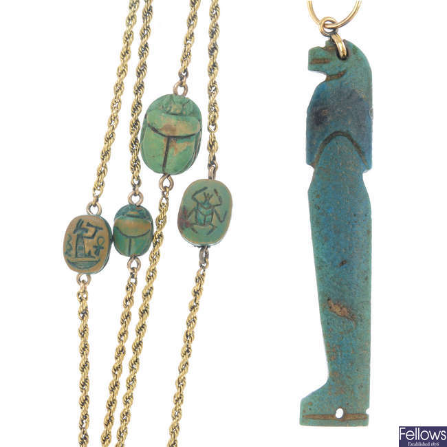 An Egyptian amulet and early 20th century longuard chain.