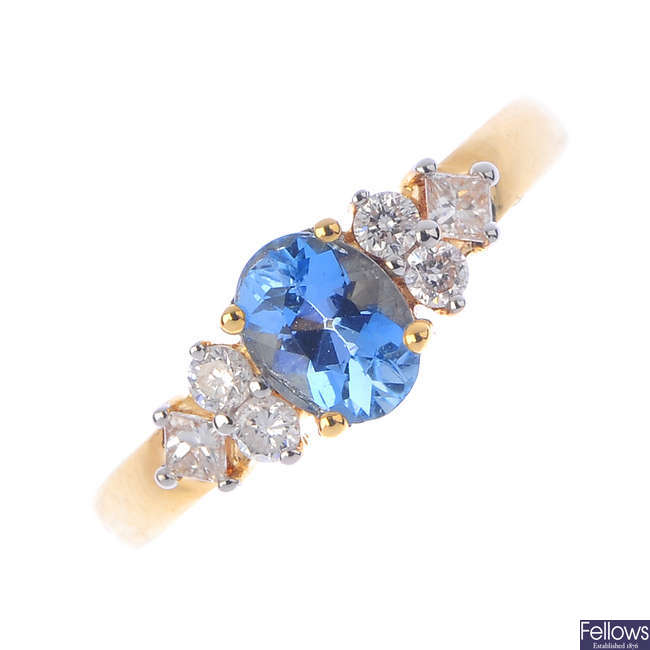 An 18ct gold aquamarine and diamond dress ring.