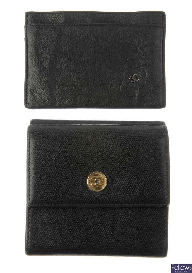 CHANEL - a black leather purse and card case.