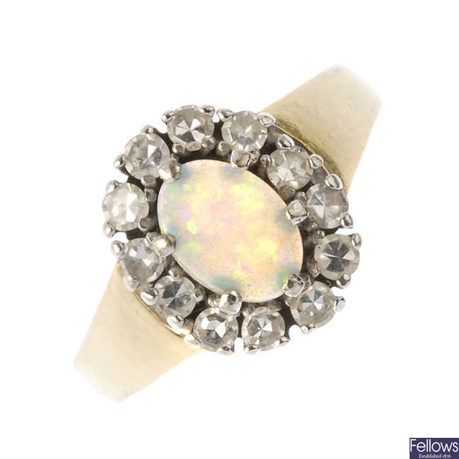 An 18ct gold opal and diamond cluster ring.