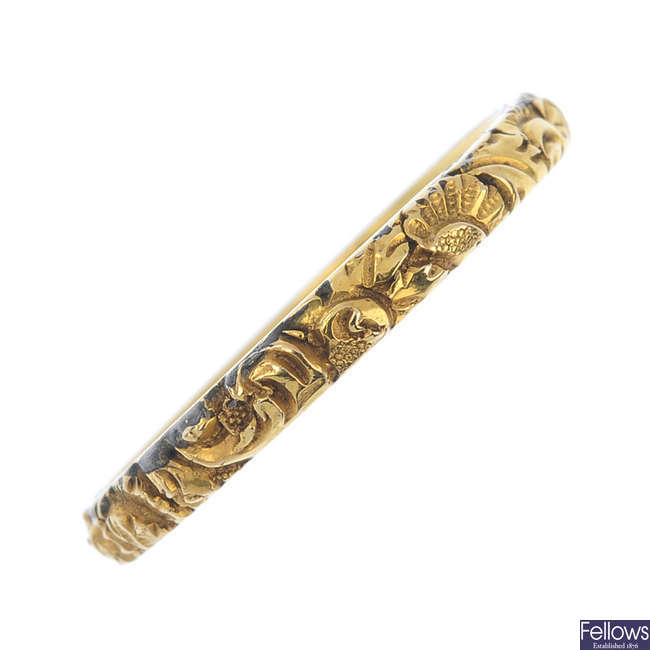 An early 19th century floral embossed band ring.