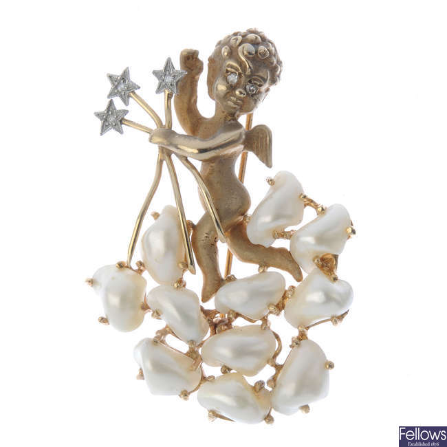 A blister pearl putto brooch.