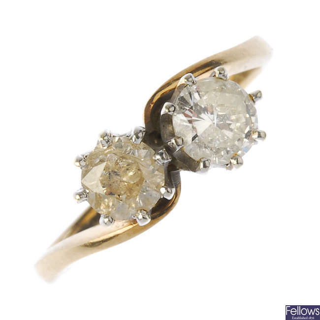 A 9ct gold diamond two-stone crossover ring.