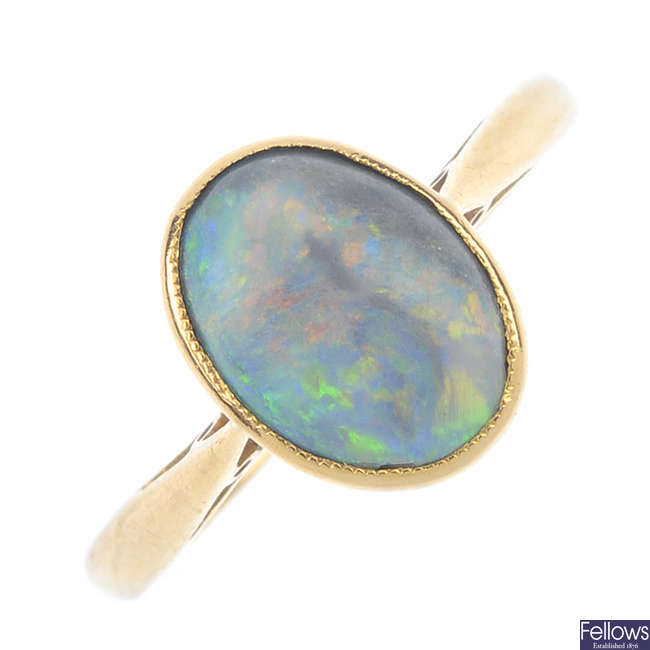 An opal single-stone ring.