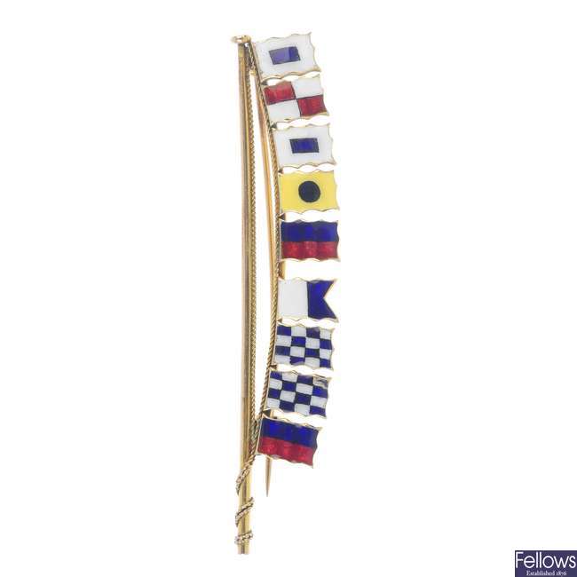 BENZIE OF COWES - an early 20th century 9ct gold enamel flag brooch.
