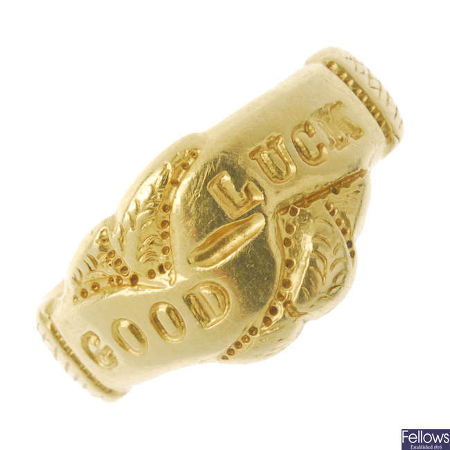 A late Victorian 18ct gold 'Good Luck' ring.