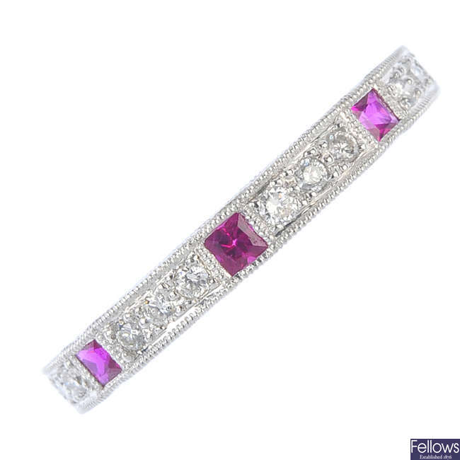 A ruby and diamond half-circle eternity ring.