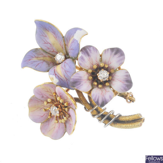 An early 20th century enamel and diamond floral brooch.