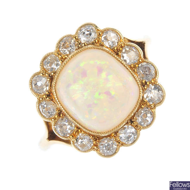 An early 20th century 18ct gold opal and diamond cluster ring.