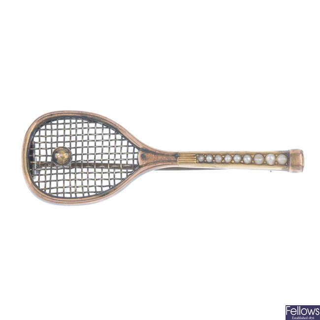 An early 20th century gold split pearl tennis racquet brooch.