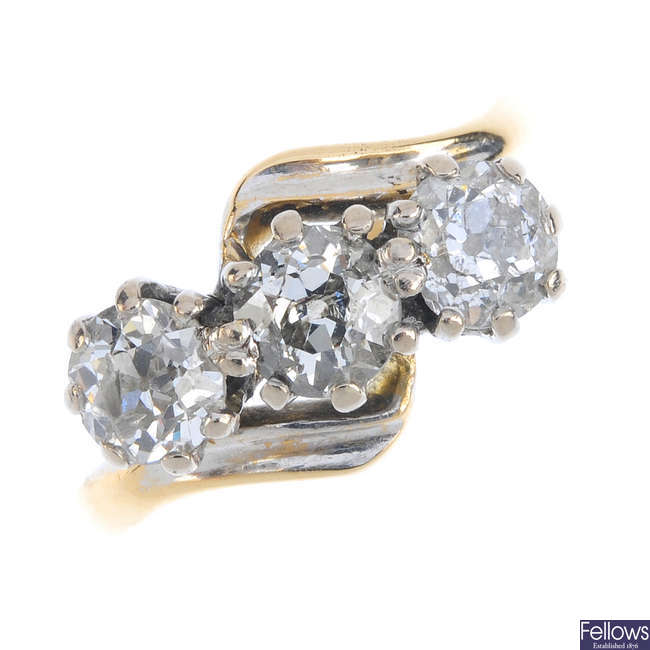 A diamond three-stone crossover ring.