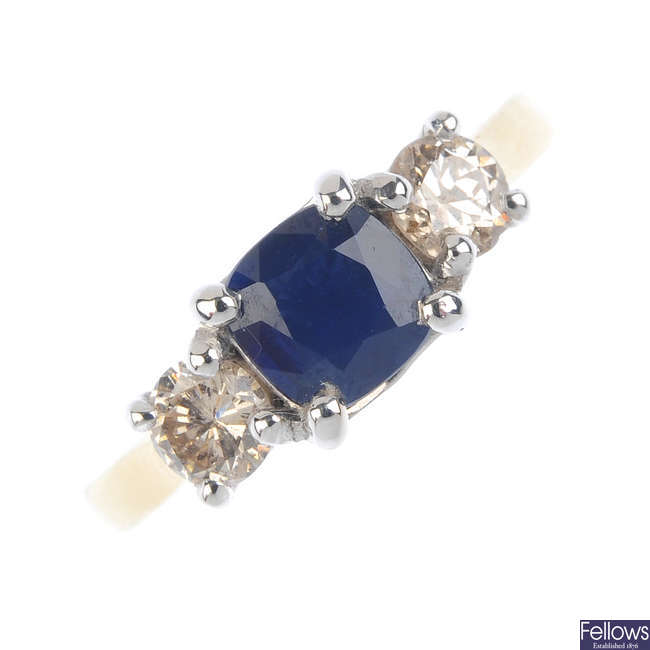 An 18ct gold sapphire and diamond three-stone ring.