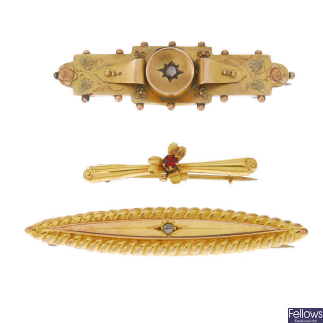 A late Victorian 9ct gold and diamond brooch with two later brooches.