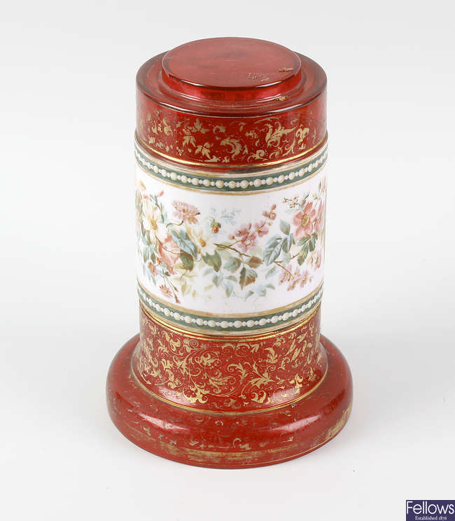 A 19th century cranberry glass pedestal.