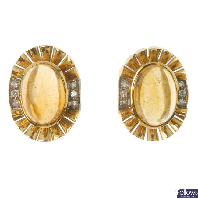 A pair of amber and diamond earrings.