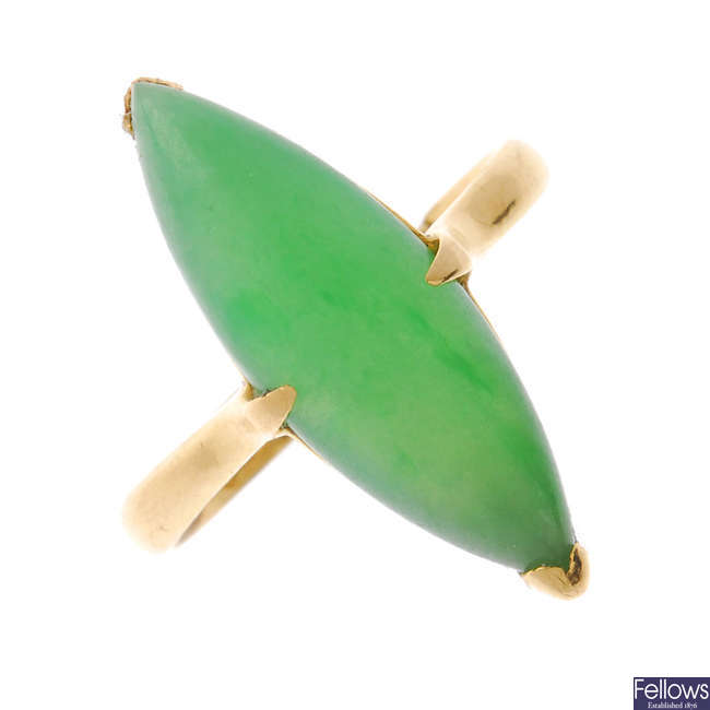 A mid 20th century gold jade single-stone ring.