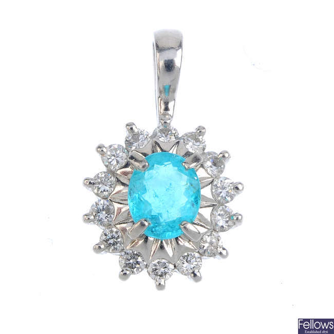 A tourmaline and diamond cluster pendant.