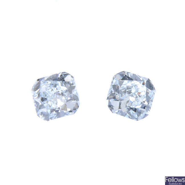 A pair of cushion-shape coloured diamonds weighing, 0.53 and 0.50ct.