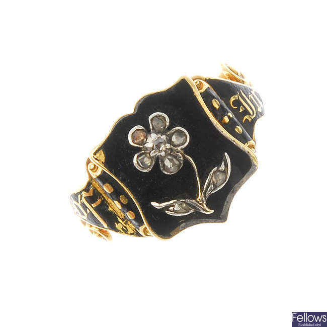 An early Victorian enamel and diamond mourning ring.