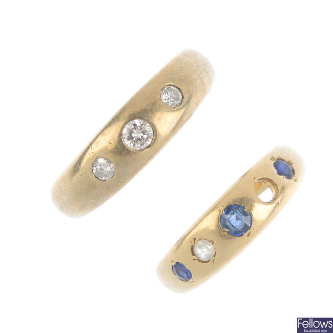 Two gold gem-set band rings.
