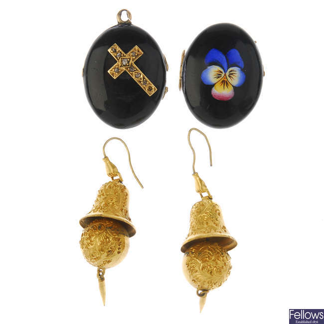 A late 19th century locket and a pair of ear pendants.