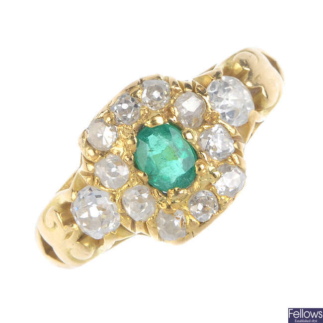 A mid 20th century 18ct gold emerald and diamond cluster ring.