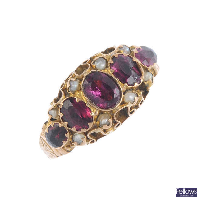 A late Victorian 9ct gold garnet and split pearl ring.