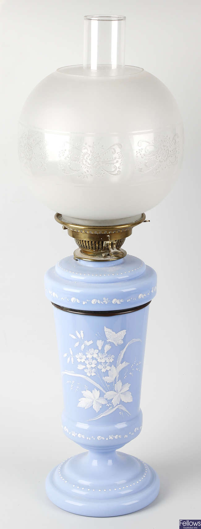 An opaque blue glass paraffin lamp.